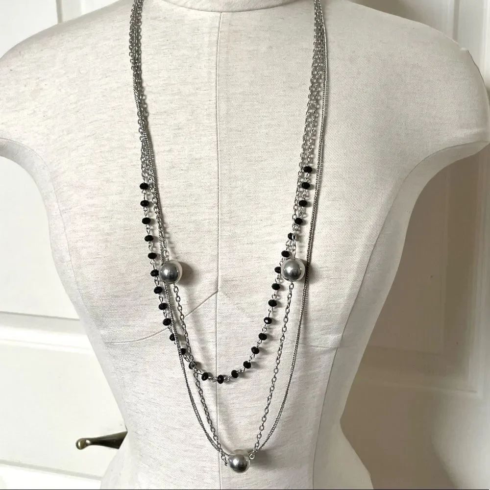 Multi strand silver tone long necklace